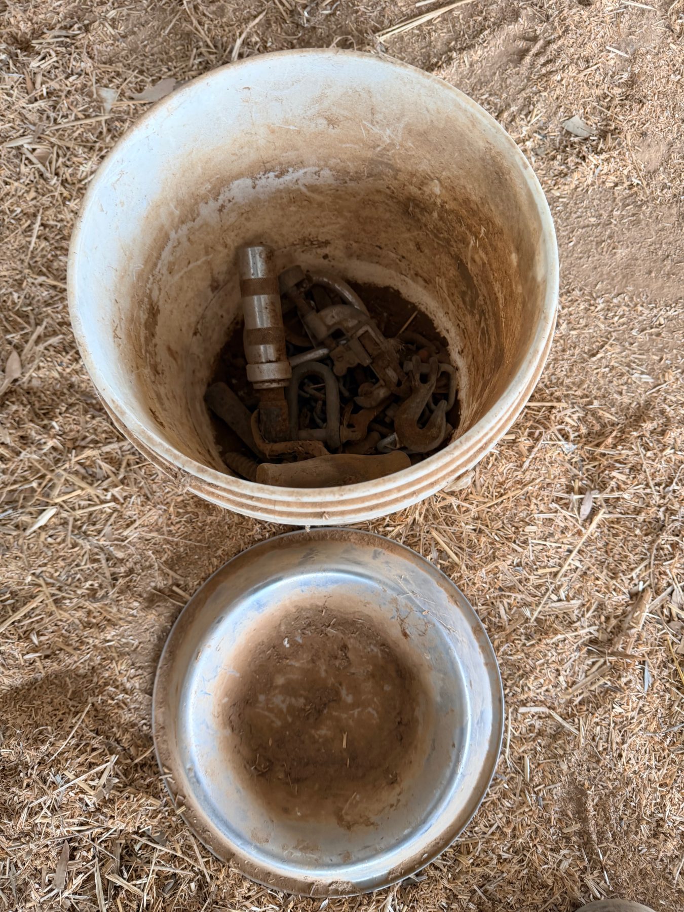Small bucket of assorted tools and dog bowl - photo 2