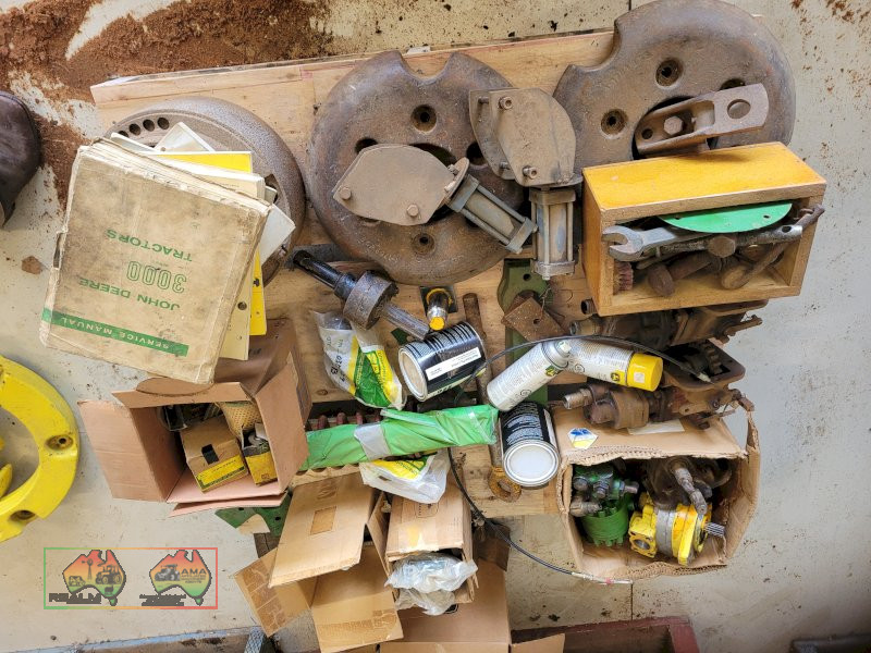 Pallet of John Deere Tractor Spares & Service Manuals