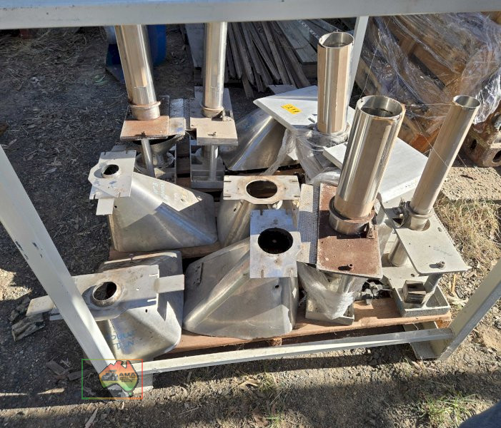 Assorted stainless steel tubes and hoppers from bagging machine