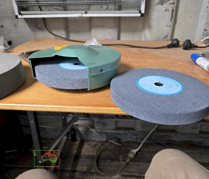 As new stone grinding wheel and as new bench grinder spares