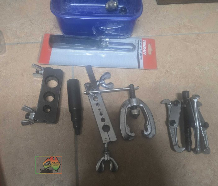 Assorted copper pipe cutters , small gear puller, & T bevel