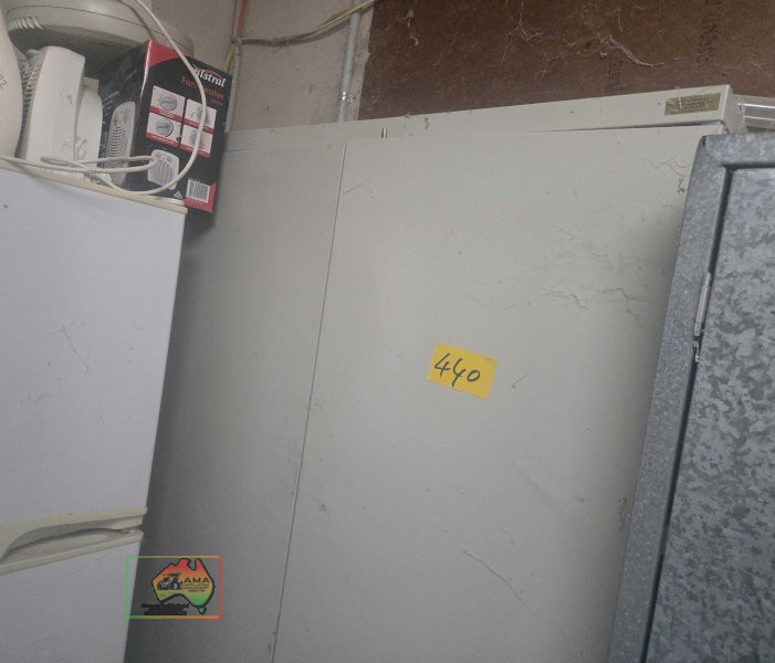 Shelved steel storage cabinet
