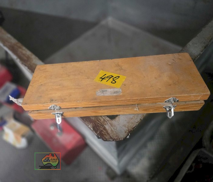 Wooden toolbox of assorted masonry drill bits