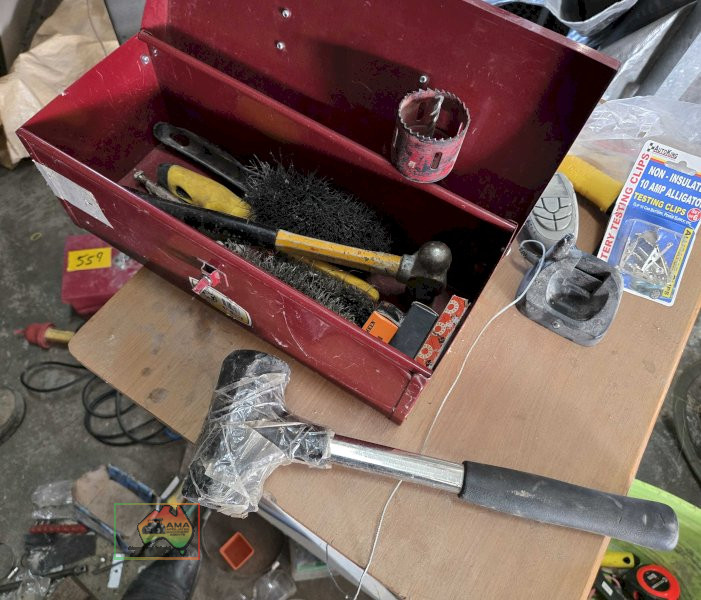 Toolbox of assorted wire brushes , hammers etc