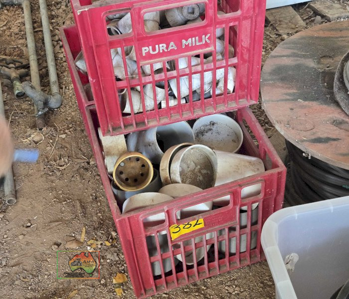 Assorted PVC Fittings in Red Crates