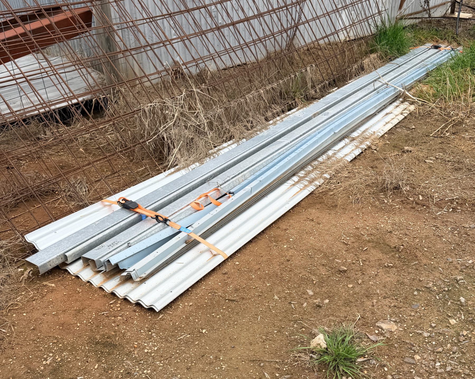 As new corrugated iron sheets, ceiling battens, and purlins