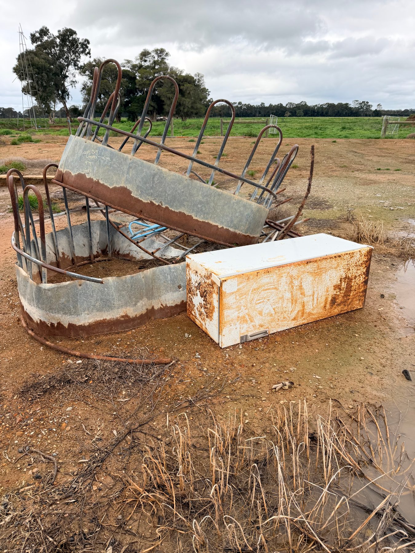 Pile of scrap steel and old fridge