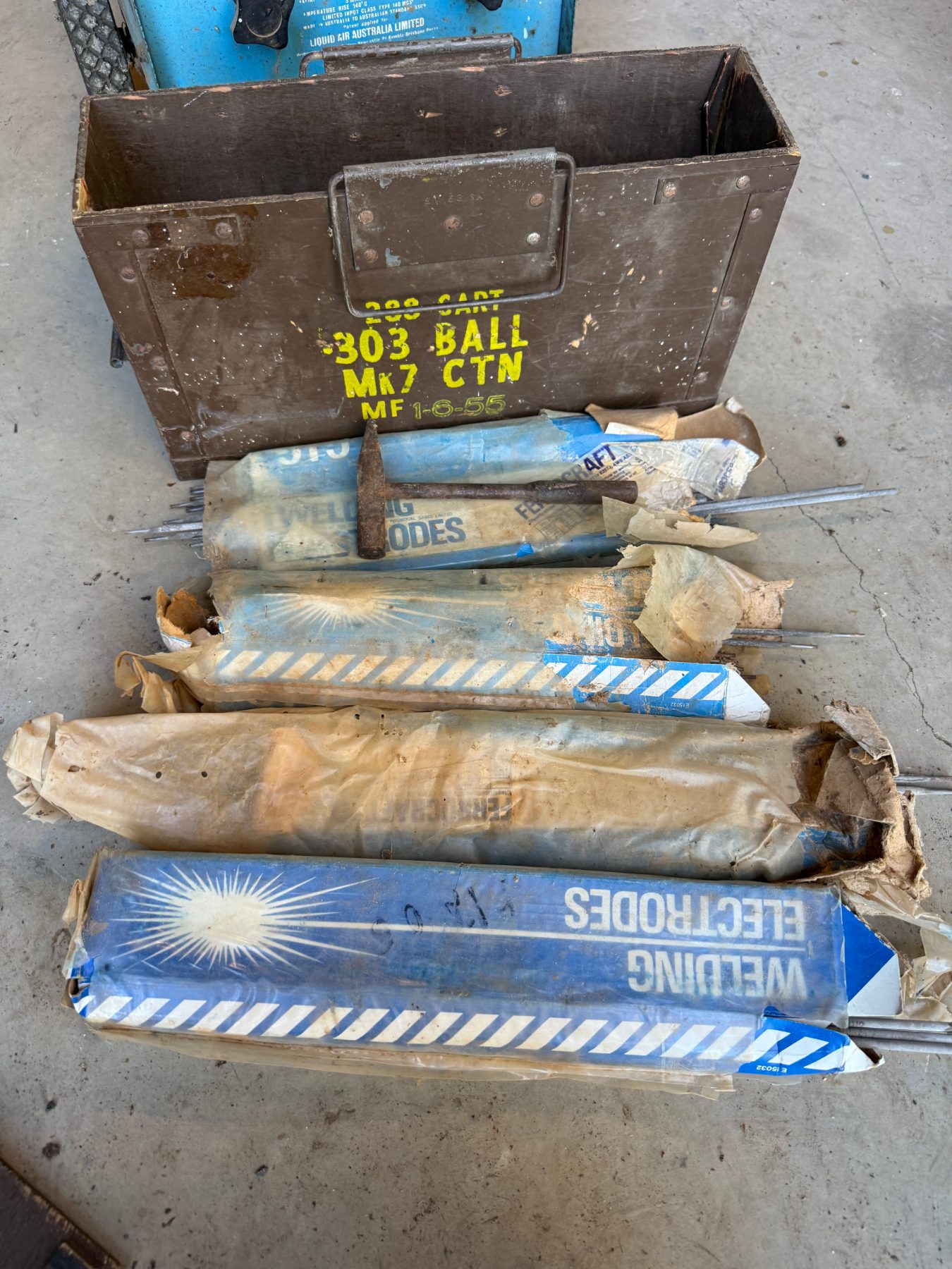 Old .303 Ammunition case with 4 packs of welding rods