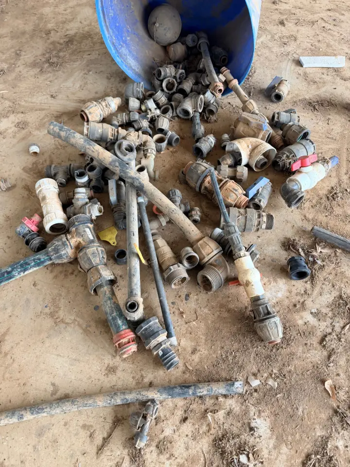 Storage tub of assorted irrigation fittings and valves