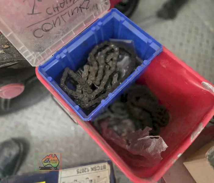 Bucket with assorted sprocket/gear chains - photo 3